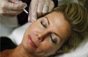 Recently unemployed Larisa Erwin gets free Botox injections from Dr. Shannan Ginnan at Reveal in Arlington, Virginia