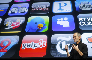 Apple Inc. CEO Steve Jobs speaks in front of the display showing buttons of various apps during the iPhone OS4 special event at Apple headquarters in Cupertino
