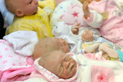 Baby dolls are displayed at the "Northern German puppet, teddy bear and miniatures" fair in Hamburg