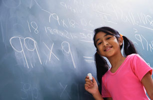 girl working at chalkboard, facing camera (horizontal)