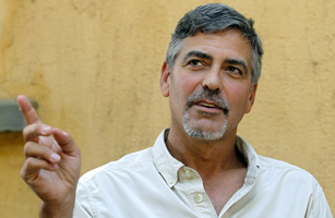 Actor Clooney gestures during an interview with Reuters in Southern Sudan's capital Juba