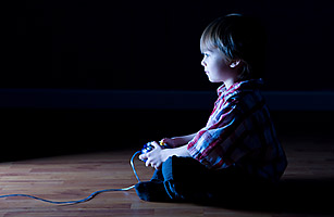 kid playing a video game