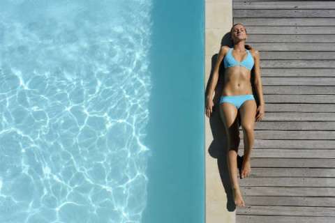 sunless tanning reduces the real thing