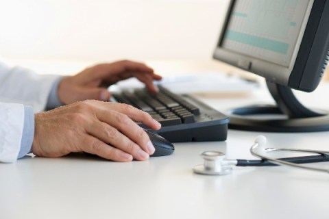 Doctor on computer