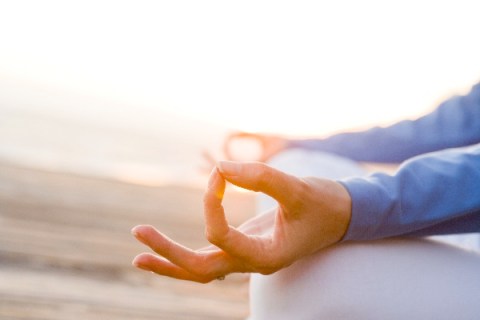 Hands of person meditating
