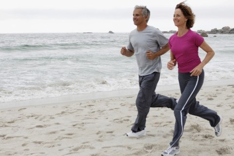 Middle-aged couple running