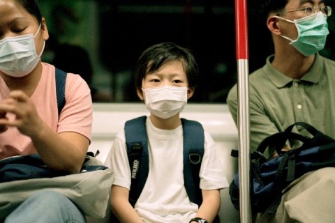Masked passengers on subway during SARS outbreak 2003