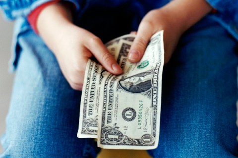 Girl Holding Dollar Bills Money