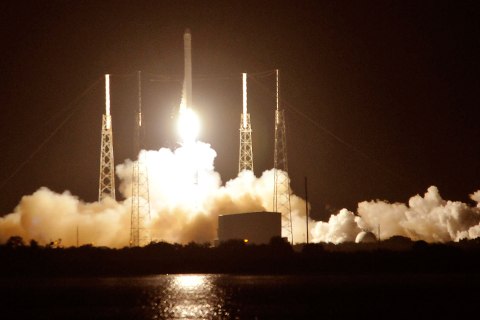 image: SpaceX's Falcon 9 rocket blasts off as it heads for space carrying the company's Dragon CRX-1 spacecraft at Cape Canaveral, Fla., Oct. 7, 2012.
