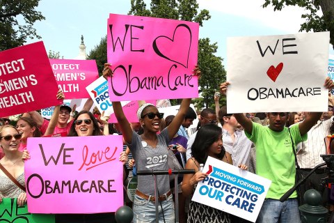 image: Obamacare supporters react to the U.S. Supreme Court decision to uphold President Obama's health care law in Washington, June 28, 2012.