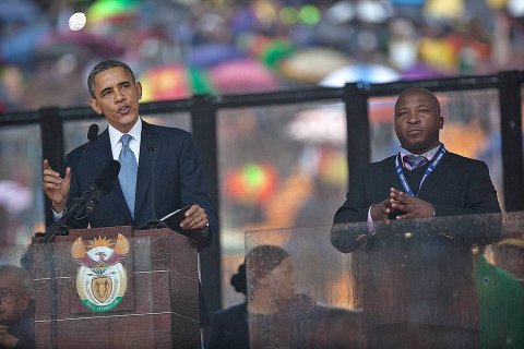 From left: U.S. President Barack Obama and Thamsanqa Jantjie during Obama's speech at the Nelson Mandela Memorial at FBN Stadium, Johannesburg, on Dec. 10, 2013.