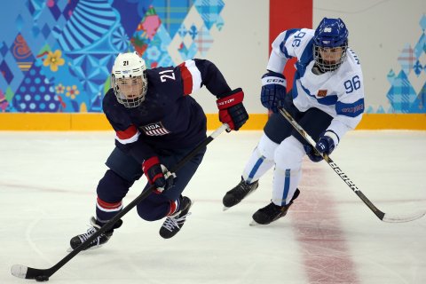 From left: U.S. forward Hilary Knight (21) skates ahead of Finland's Emma Nuutinen (96) during the second period in a women's hockey game at the 2014 Winter Olympics in Sochi, on Feb. 8, 2014.